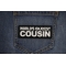World's Okayest Cousin Patch shown on jeans