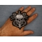 Skull and Roses Patch shown on hand for size comparison