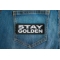 Stay Golden Patch shown on jeans