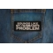 Sounds Like My Husband's Problem Patch shown on jeans