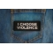 I Choose Violence Patch shown on jeans