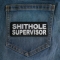 Shithole Supervisor Patch shown on jeans