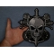 Skull and Roses Patch shown on hand for size comparison
