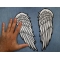 Angel Wings Patch shown on hand for size comparison