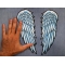 Angel Wings Patch shown on hand for size comparison