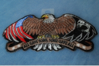 Patriotic eagle, wings spread out wide, American flag tattooed on the left, POW MIA flag on the right  