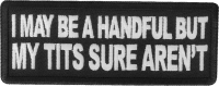 I may be handful but my tits sure aren't patch