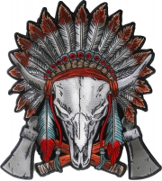 Buffalo skull wearing a head dress and feather hanging from it's horns, crossed axes at the bottom
