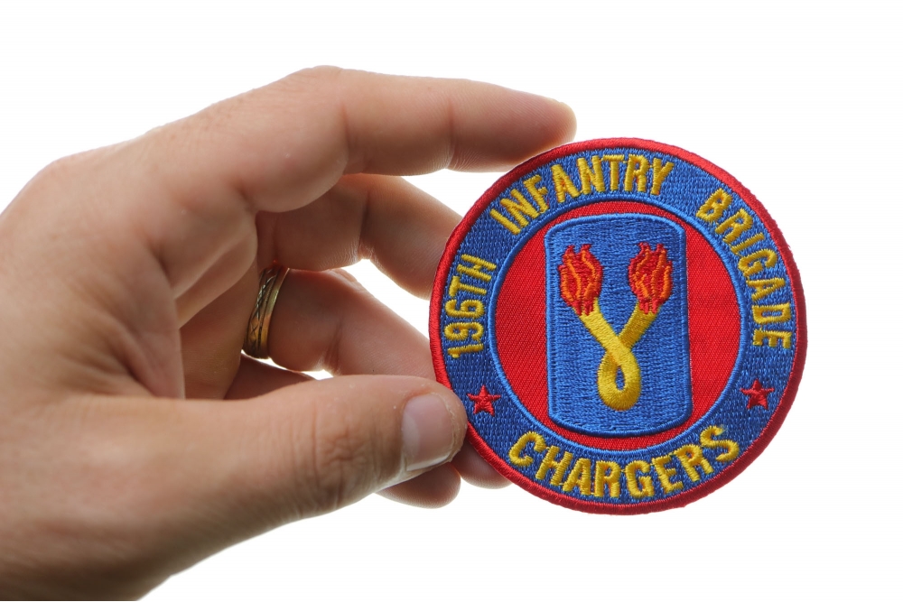 196th Infantry Brigade Patch Chargers shown on hand for size comparison