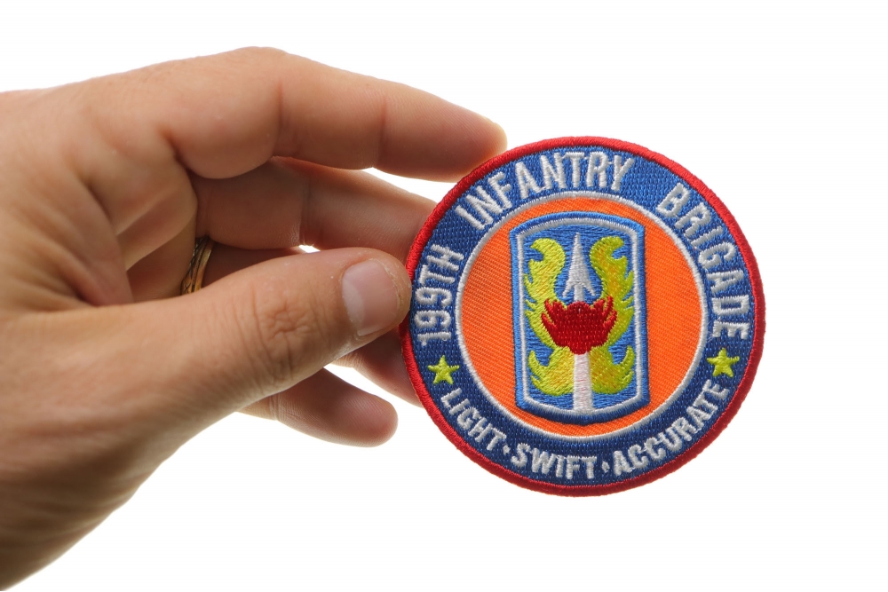 199th Infantry Brigade Patch Light Swift Accurate shown on hand for size comparison