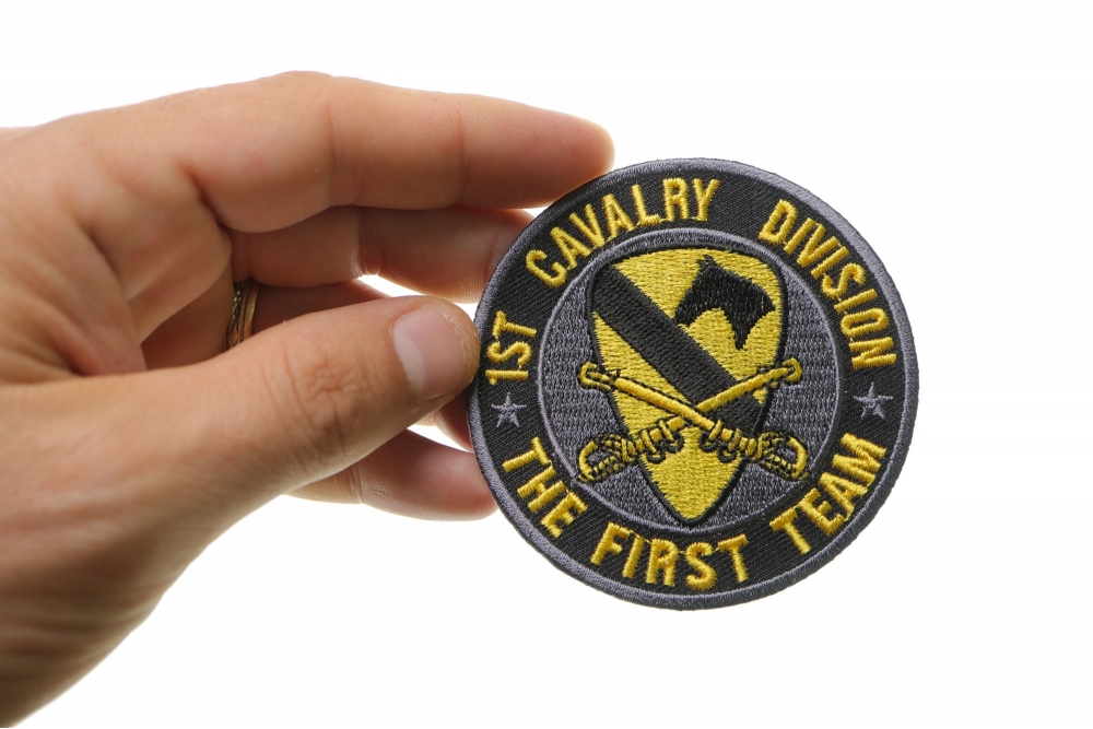1st Cavalry Division Patch The First Team shown on hand for size comparison