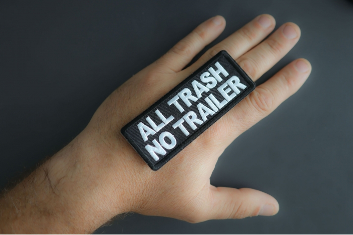 All Trash No Trailer Patch shown on hand for size comparison