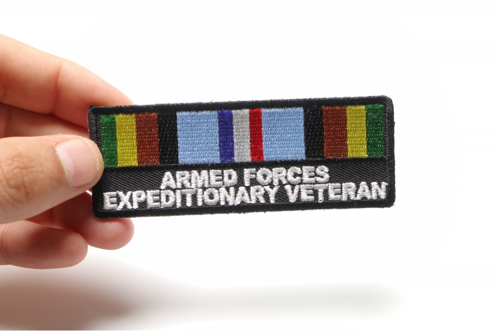 Armed Forces Expeditionary Patch shown on hand for size comparison
