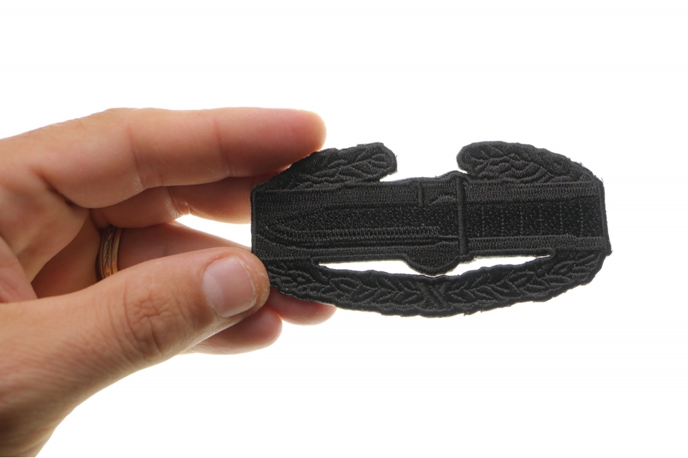 Combat Action Badge Iron on Patch shown on hand for size comparison