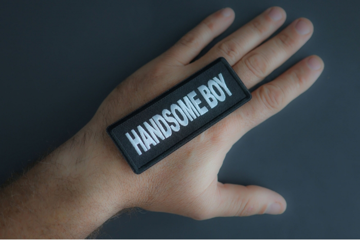 Handsome Boy Patch shown on hand for size comparison