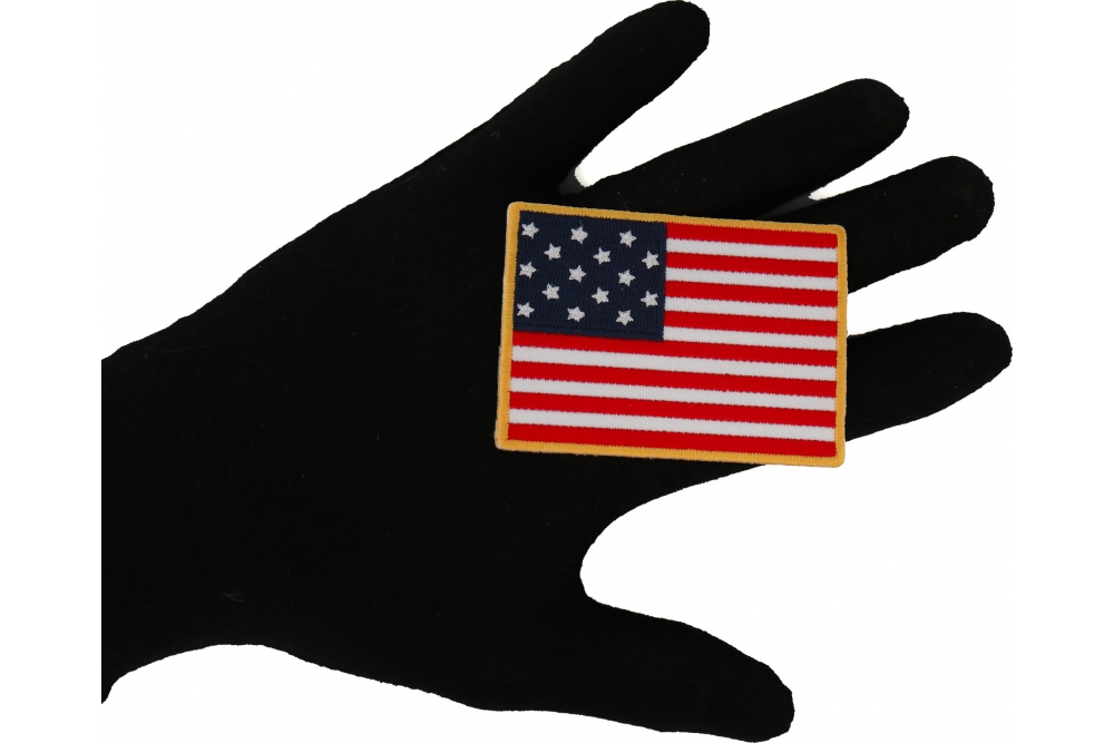 Historical Star Spangled Banner Flag Iron on Patch shown on hand for size comparison