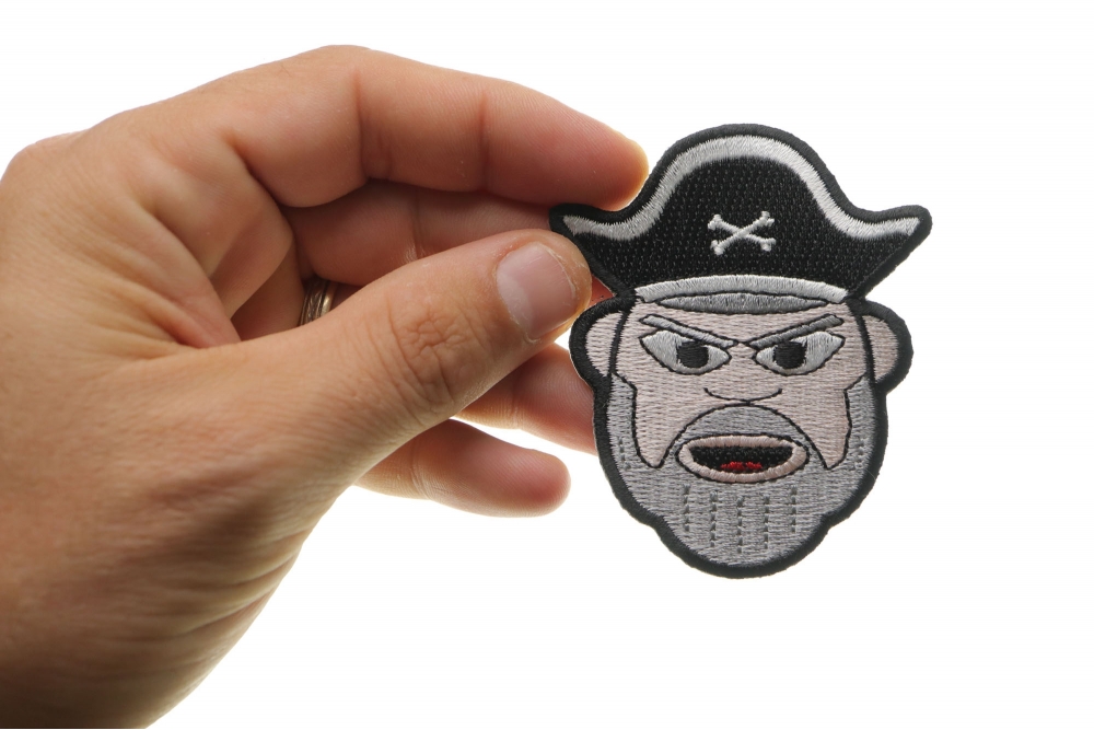 Old Man Bearded Pirate Iron on Patch shown on hand for size comparison