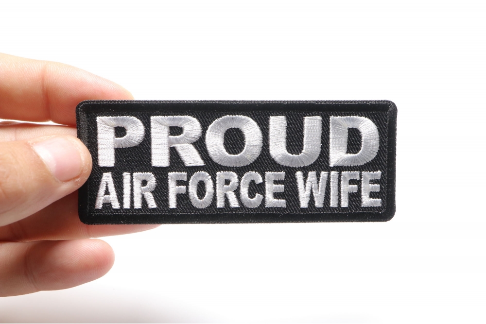 Proud Air Force Wife Patch shown on hand for size comparison