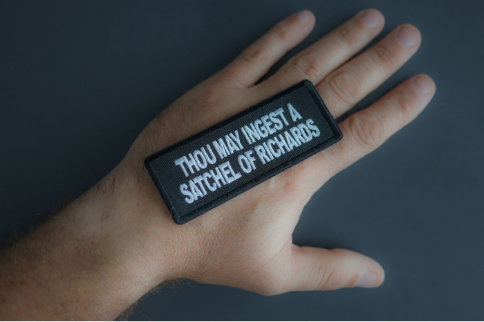 Thou May Ingest A Satchel Of Richards Patch shown on hand for size comparison