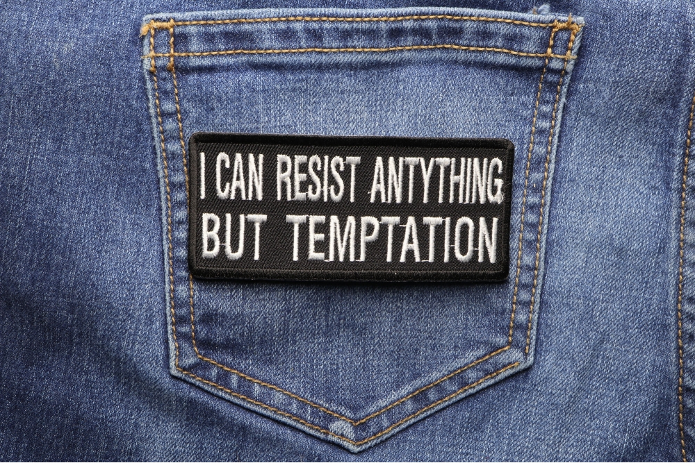I Can Resist Anything But Temptation Patch shown on jeans