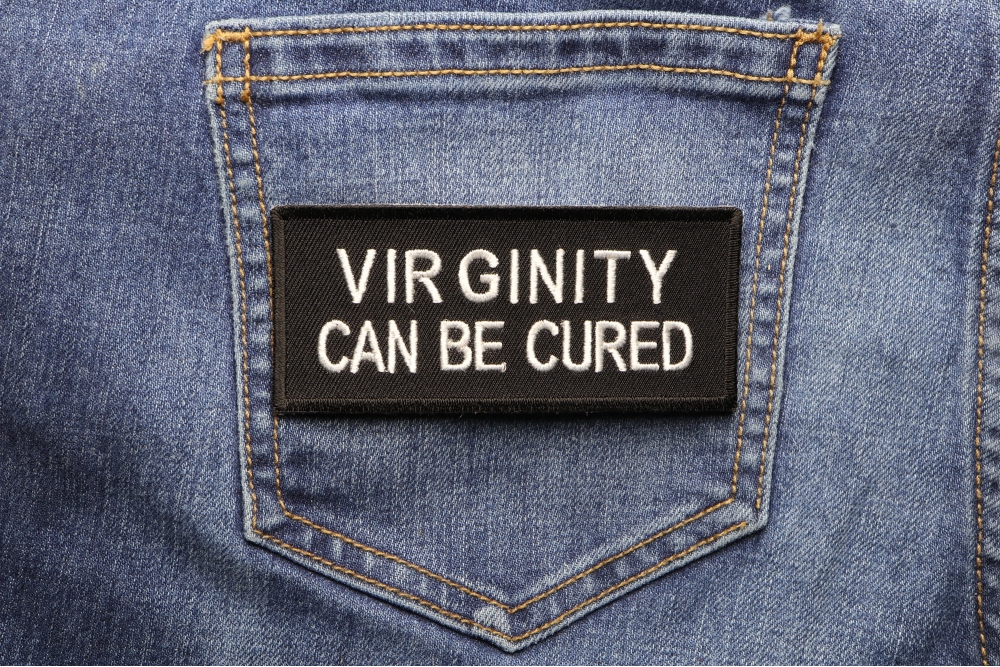 Virginity Can Be Cured Patch shown on jeans
