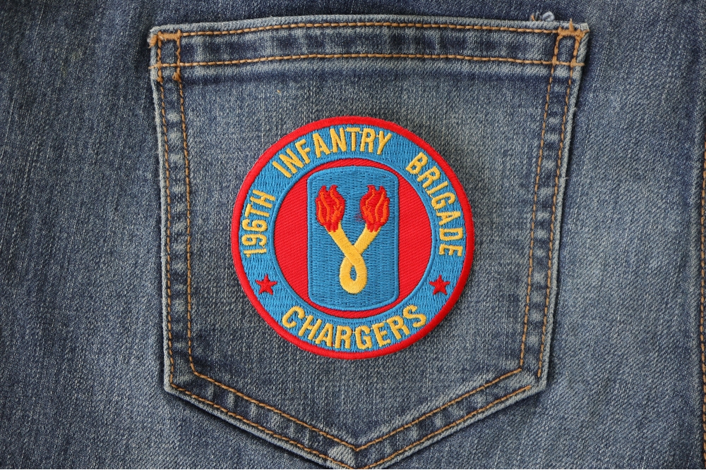 196th Infantry Brigade Patch Chargers shown on jeans