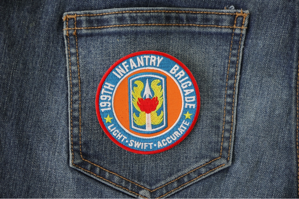 199th Infantry Brigade Patch Light Swift Accurate shown on jeans