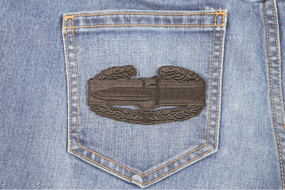 Combat Action Badge Iron on Patch shown on jeans