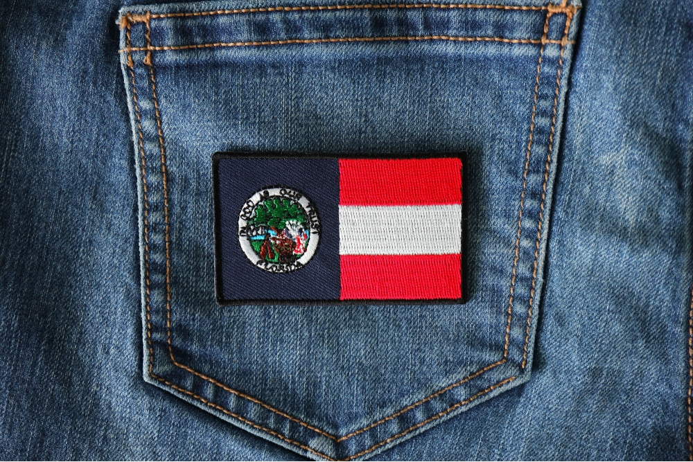 Historical Florida Flag Iron on Patch shown on jeans