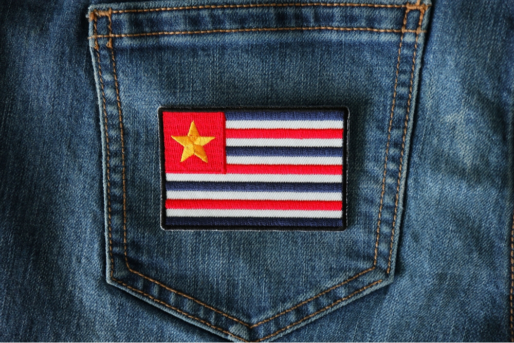 Louisiana Flag Iron on Patch - Old Historical shown on jeans