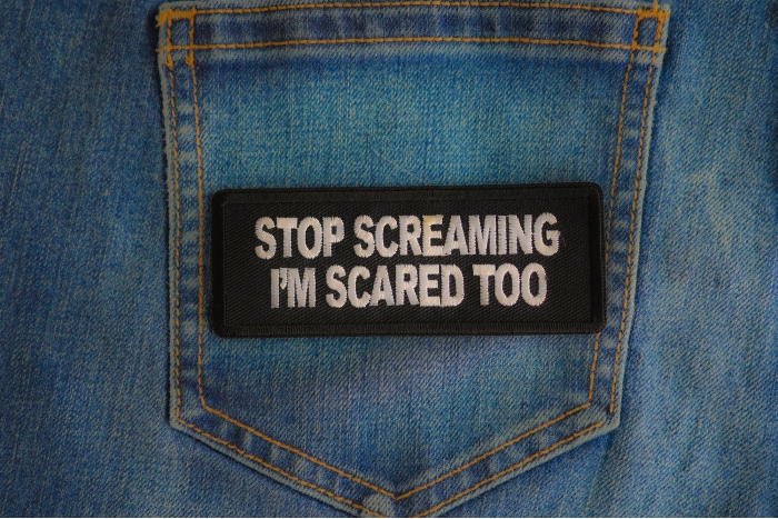 Stop Screaming I'm Scared Too Patch shown on jeans