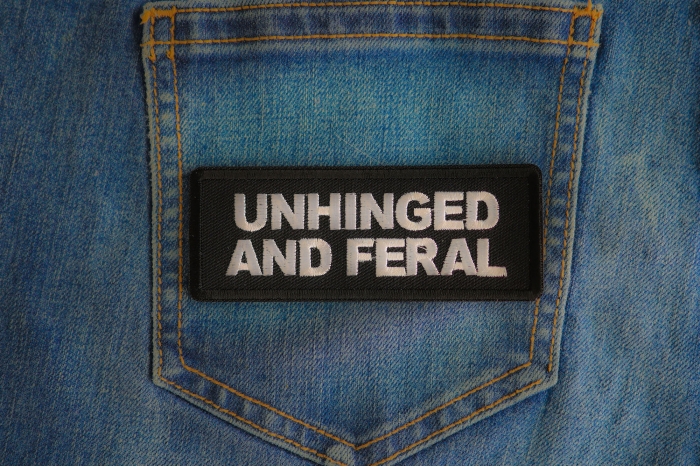 Unhinged And Feral Patch shown on jeans