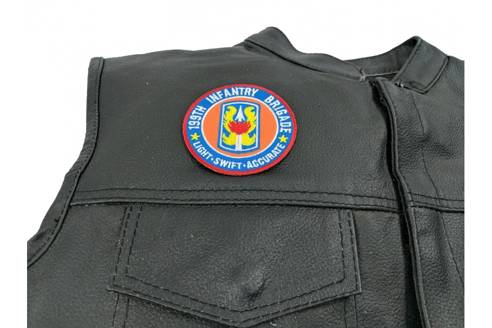 199th Infantry Brigade Patch Light Swift Accurate - 3x3 inch. Embroidered Iron on Patch shown on leather vest