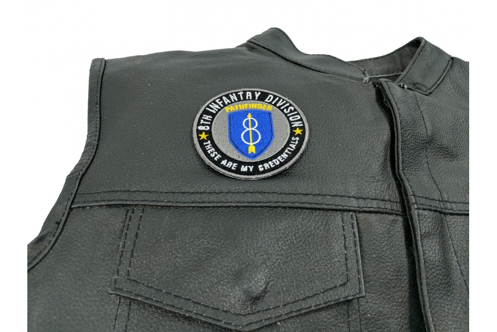 8th Infantry Division Pathfinder Patch - 3x3 inch. Embroidered Iron on Patch shown on leather vest