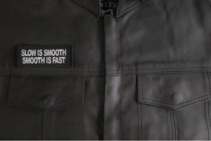 Slow Is Smooth Smooth Is Fast Patch shown on leather vest