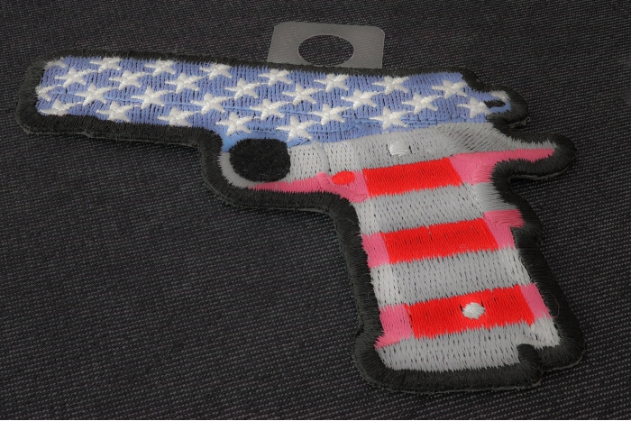 9 Mm Gun With US Flag Patch diagonal view