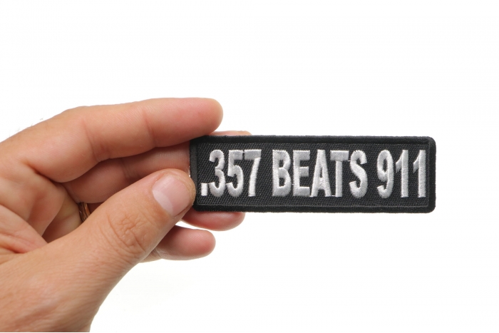 357 Beats 911 Patch, Biker Sayings shown on hand for size comparison