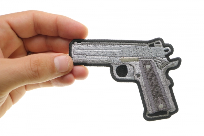 9 Mm Gun Patch shown on hand for size comparison