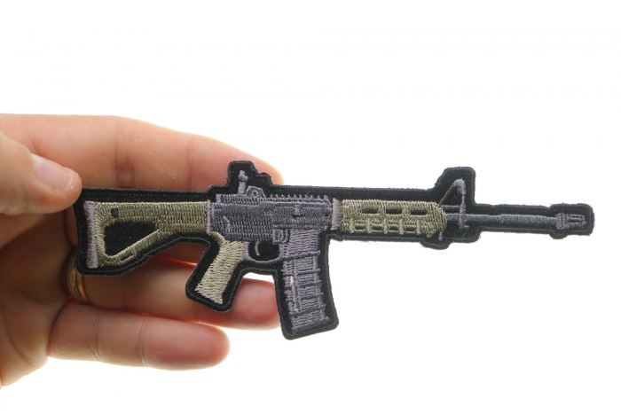AR 15 Assault Rifle Patch shown on hand for size comparison