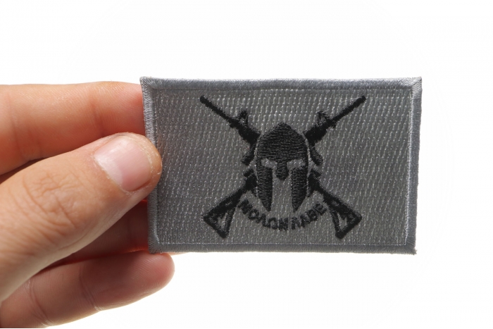 Black and Gray Come and Take It Molon Labe Spartan Crossed Rifles Patch shown on hand for size comparison