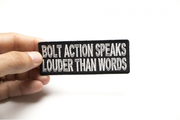 Bolt Action Speaks Louder Than Words Patch shown on hand for size comparison