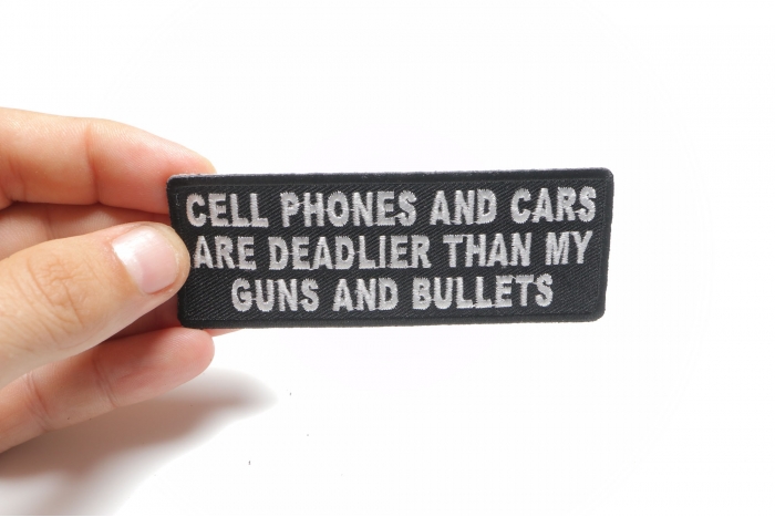 Cell Phones and Cars Are Deadlier Than My Guns and Bullets Patch, Biker Sayings shown on hand for size comparison