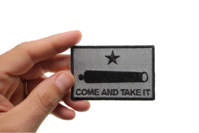 Come and Take It Cannon Star Patch shown on hand for size comparison