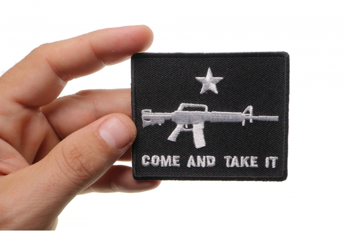 Come and Take It Star Machine Gun Patch shown on hand for size comparison