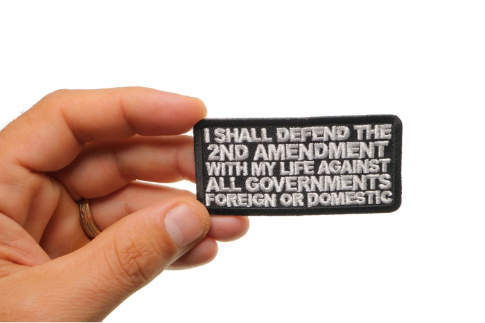 I Shall Defend The 2nd Amendment With My Life Against All Governments Foreign or Domestic Patch shown on hand for size comparison