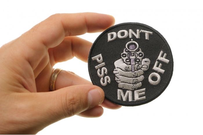 Do Not Piss Me Off With A Gun Patch shown on hand for size comparison