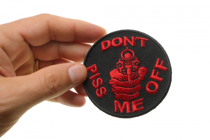 Don't Piss Me Off Gun Patch In Red shown on hand for size comparison