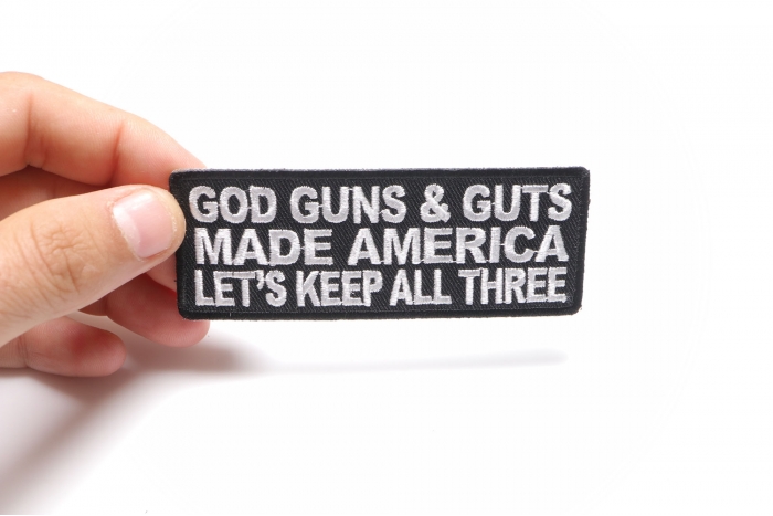 God Guns and Guts Made America Let's Keep All Three Patch, Patriotic Saying Patches shown on hand for size comparison