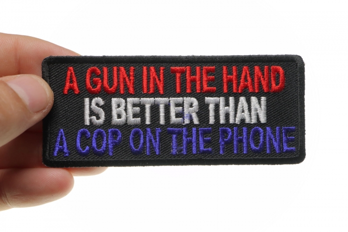 Gun In Hand Better is Better Than Cop On Phone Patch shown on hand for size comparison