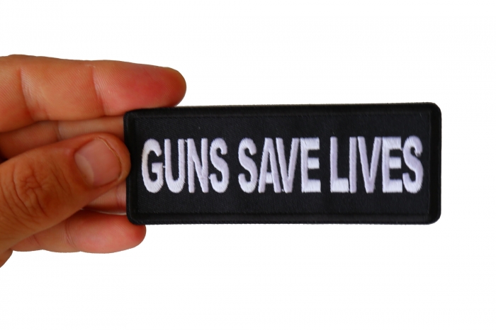 Guns Save Lives Patch shown on hand for size comparison